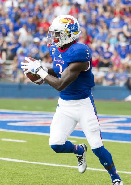 Kansas senior receiever Tony Pierson looks up field after making a catch in the flat during Kansas' game against Central Michigan on Saturday afternoon at Memorial Stadium.