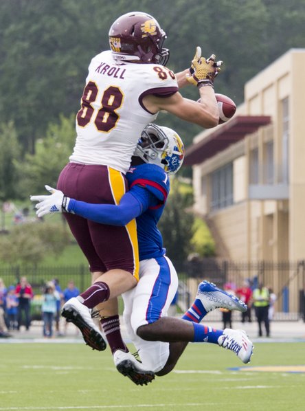 Kansas freshman cornerback Matthew Boateng (1) breaks up a pass intended for Central Michigan receiver Jesse Kroll during their game on Saturday afternoon at Memorial Stadium.