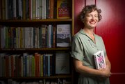 Phoenix Award winner Heidi Raak, owner of the Raven Bookstore is pictured at the downtown bookseller on Thursday, Oct. 9, 2014.