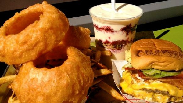 A meal from BurgerFi, featuring the restaurant's hand-dipped, freshly prepared onion rings. 
Photo courtesy Charlie Guzzetta/BurgerFi