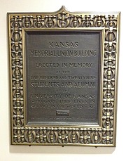 This small plaque, inscribed as a gift of the class of 1924, is displayed on the main level of the Kansas Union. It reads, "Kansas Memorial Union Building, erected in memory of the one hundred and twenty nine students and alumni of the University of Kansas who gave their lives in service in the world war." A few other World War I related wall displays appear on the sixth floor of the Union.