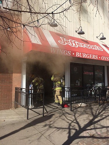 Firefighters investigate a fire at Jefferson's, 743 Massachusetts St., on Jan. 15.