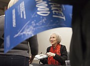 Author Margaret Atwood signs books after a lecture at the Kansas Union Ballroom. Atwood delivered the Kenneth A. Spencer Memorial Lecture to over 1,000 people on Monday night in a speech that combined pop culture, humor and intellectual observation.