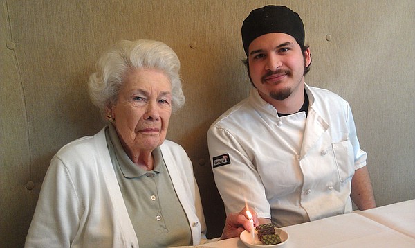 Betty Jane Moore, shown here with former Pachamamas pastry chef Jay Tovar-Ballagh on her 97th birthday, is celebrating her 100th birthday at the restaurant a few weeks early this year. 