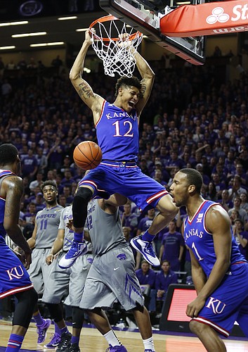 Kansas guard Kelly Oubre Jr. (12) dunks against Kansas State during the second half, Monday, Feb. 23, 2015 at Bramlage Coliseum.