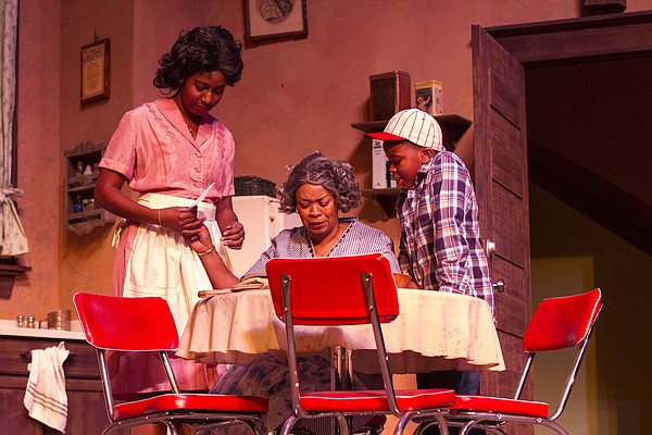 From left, Diadra Smith, Catherine A. Collins and Tripp Starr rehearse a scene from "Raisin in the Sun" on Wednesday at Crafton-Preyer Theatre in Murphy Hall. The KU University Theatre production opens Friday, and is in conjunction with Theatre Lawrence's production of "Clybourne Park," which also opens Friday and runs through March 8.