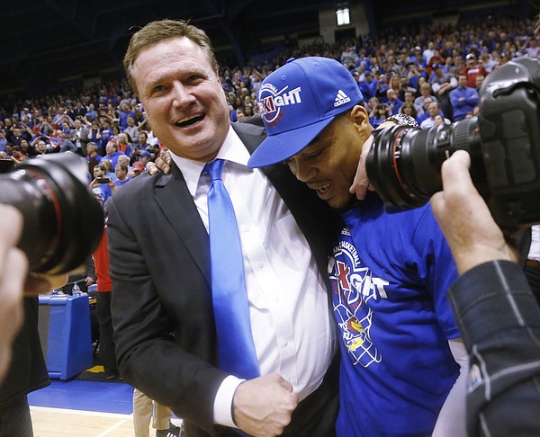 Coach Bill Self congratulates Kansas guard Frank Mason III after the Jayhawks overtime win over the West Virginia Mountaineers Tuesday, March 4.