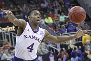 KU's Devonte' Graham (4) loses the ball during the Jayhawk’s 64-59 win over TCU Thursday at the Sprint Center in Kansas City, MO.