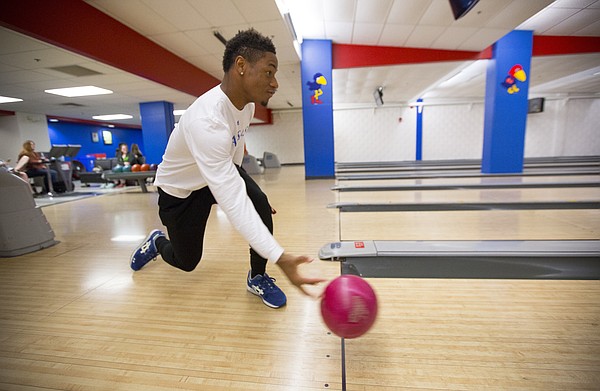 Kansas University freshman Darious Crawley, Houston, Texas, rolls down the lane during a bowling class on Tuesday, April 14, 2015 at Jaybowl. The bowling alley, which has been around since 1953, will close in early May.