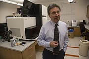 Peter Smith, KU Medical Center professor of molecular and integrative physiology, directs the Institute for Neurological Discoveries and co-directs the Intellectual and Developmental Disabilities Research Center. He is pictured in front of the Medical Center's DNA sequencing machine speaking about genomic sequencing and related research going on at KU.