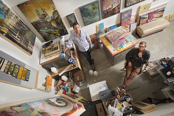 Lawrence artists John Sebelius, left, and Jeromy Morris are pictured at SeedCo Studios in this Journal-World photo from May 20, 2015. Sebelius and Morris collaborated on a show, "More Than Meets the Eye," in which the two artists have combined their visions on various mixed media pieces that premiered at the Cider Gallery earlier this year. 