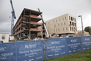 Pictured in June 2015, Capitol Federal Hall, the new KU School of Business building, is going up on Naismith Drive across from Allen Fieldhouse. Construction is slated for completion in spring 2016, and the 166,500-square-foot building will open for classes by fall. The total project cost is $70.5 million, with the $60.5 million construction cost coming from private funds.