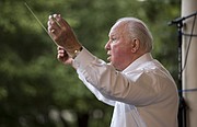 Bob Foster conducts the Lawrence City Band during their concert at South Park on Wednesday, July 8, 2015.