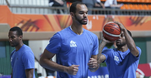 Team USA players from left, Wayne Selden Jr., Perry Ellis and Frank Mason III warm-up before a Team USA quarter-final game against Lithuania Saturday, July 11, at the World University Games in Gwangju, South Korea.