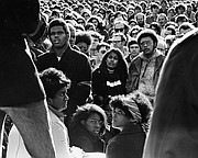 Black and white youths gather for a rally in front of Strong Hall at Kansas University in this file photo from December 1970. Some participants carried posters of Rick Dowdell, who was killed that July.