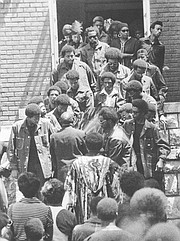 The casket of Donald Rick Dowdell, 19, is carried from the St. Luke A.M.E. Church, 900 N.Y., in this July 23, 1970, file photo. Dowdell was fatally shot by police after a car chase. The front two pallbearers at left are Dowdell's brothers, Randy and Stephen Dowdell, and the fourth man back on the left side is Duane Vann, former president of the Kansas University Black Students Union.