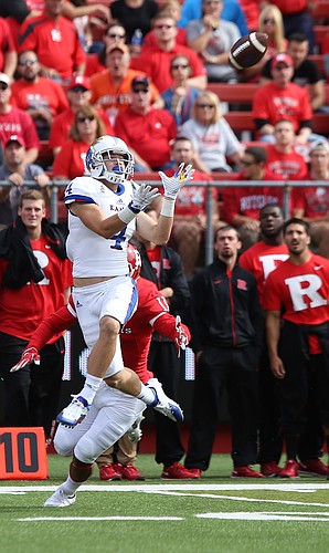 Kansas wide receiver Tyler Patrick (4) gets up for a deep pass during the third quarter on Saturday, Sept. 26, 2015 at High Point Solutions Stadium in Piscataway, New Jersey. The catch helped to set up a Kansas touchdown.