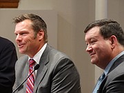 Kansas Secretary of State Kris Kobach, left, and Kansas University law professor Stephen McAllister respond to questions from an audience on the KU campus during a symposium on voting laws entitled "Protecting the Vote."