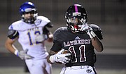 Lawrence High's JD Woods goes 25 yards for his fifth TD of the night in a 63-7 victory over Olathe South on Friday, Oct. 9, 2015, at LHS.