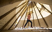 Quail Run second-grader Ryan Toomay is the first of her classmates to head inside a tepee outside the school on Thursday, Oct. 15, 2015. The tepee was lent to fifth-grade teacher Brenda Meyers, who is teaching her social studies class about Native American history and cultures. The fifth-graders visited the tepee with their second-grade buddies, who have recently done a unit on the Native Americans of the plains region.