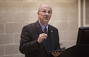 Kansas University professor and University Senate President Mike Williams moderates an information session about guns on campus Tuesday, Dec. 8, 2015, in KU's Budig Hall.