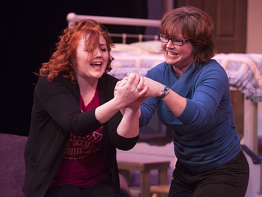 Skye Reid, left, and Hailey Gillespie run through a scene together during a dress rehearsal for Theatre Lawrence's upcoming production of "Girls' Weekend" on Thursday, Jan. 14, 2016. The show opens on Jan. 22 with a curtain time of 7:30 p.m. at Theatre Lawrence, 4660 Bauer Farm Dr.