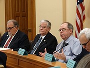 Sen. Anthony Hensley, D-Topeka, second from right, raises questions about a special committee's report on K-12 school funding with the committee chairman Rep. Ron Highland, R-Wamego, and Sen. Steve Abrams, R-Arkansas City.