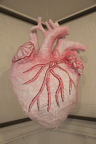 Lawrence artist Liza MacKinnon created a 3-foot-tall, papier-mache human heart for the Lawrence Percolator's new show "Group Love," which encourages artists to explore the theme of love. The show opens Friday at the Percolator, 913 Rhode Island St. 