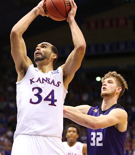 Kansas forward Perry Ellis (34) heads up for a dunk against Kansas State forward Dean Wade (32) during the second half on Wednesday, Feb. 3, 2016 at Allen Fieldhouse.