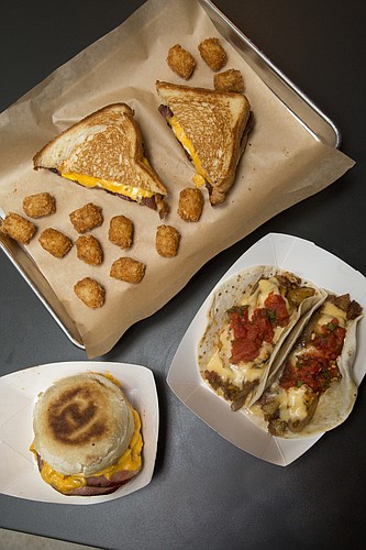Clockwise: Leeway Franks' breakfast sandwich with tots, breakfast tacos and Mega Muffin. The sausage shop at 935 Iowa St. will debut its new breakfast menu Saturday at 8 a.m. 
