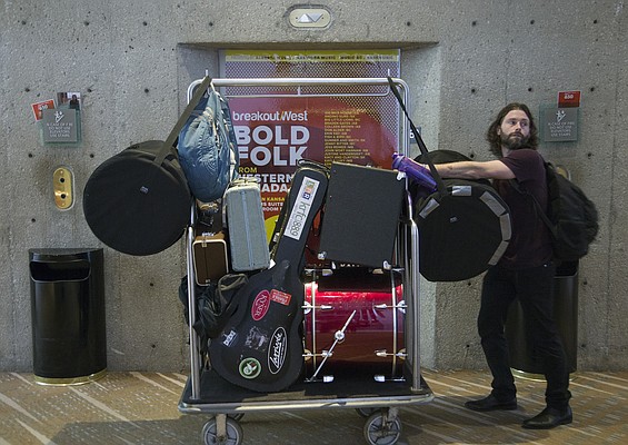 Dustin Morris, with the band Edison, Denver, CO., waits for an elevator Wed. Feb. 18, on his way to a performance inside the Westin Hotel during the Folk Alliance International Conference in K.C., MO. that runs through Sunday.