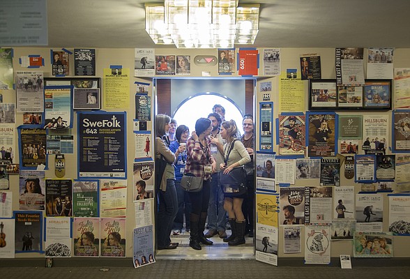 Musicians flyers fill the hallway as attendees at the Folk Alliance International Conference in K.C., MO ride the elevator to one of three Westin Hotel floors, Wed. Feb. 18. where musicians perform private showcases at the conference in K.C., MO. that runs through Sunday.