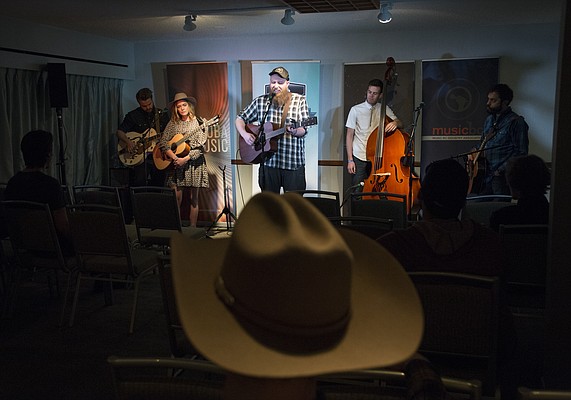 A group of Canadian musicians perform in the Folk Canada room at the Westin Hotel Wed. Feb. 18, during the Folk Alliance International Conference in K.C., MO. that runs through Sunday.