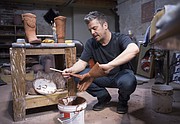 Ben Ahlvers, exhibitions director at the Lawrence Arts Center applies a glaze to sections of a larger ceramic piece that Ahlvers will show, in an exhibit titled "Ordinary Opposites" along with artist Russell Wrankle, Toquerville, Utah, at 2016 Main St. gallery in the Crossroads Arts District, March 15-19 in conjunction with the National Council on Education for Ceramics Arts conference in Kansas City this month. The Lawrence Arts Center, KU and Brackers Good Earth Clays of Lawrence are hosting several local exhibits and events in advance of the NCECA conference.