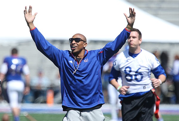 Denver Broncos cornerback and Kansas alum, Chris Harris Jr. celebrates after his team scored a touchdown during Alumni Game prior to the Spring Game on Saturday, April 9, 2016 at Memorial Stadium. Harris served as one of the coaches.