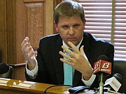 Shawn Sullivan, budget director for Kansas Gov. Sam Brownback, discusses proposals for keeping the state’s budget balanced, during a news conference, Wednesday, April 20, 2016, at the Statehouse in Topeka, Kan. Brownback plans to delay highway projects and impose additional spending cuts at state universities (AP Photo/John Hanna)
