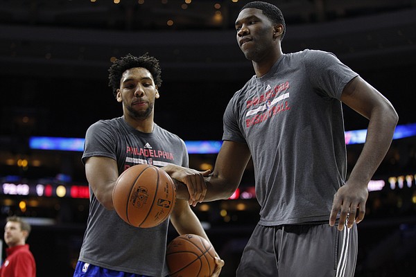 Philadelphia 76ers' Joel Embiid, right, of Cameroon plays around with Jahlil Okafor, left,prior to the first half of an NBA basketball game against the Chicago Bulls, Thursday, Jan. 14, 2016, in Philadelphia. The Bulls won 115-111 in overtime. (AP Photo/Chris Szagola)