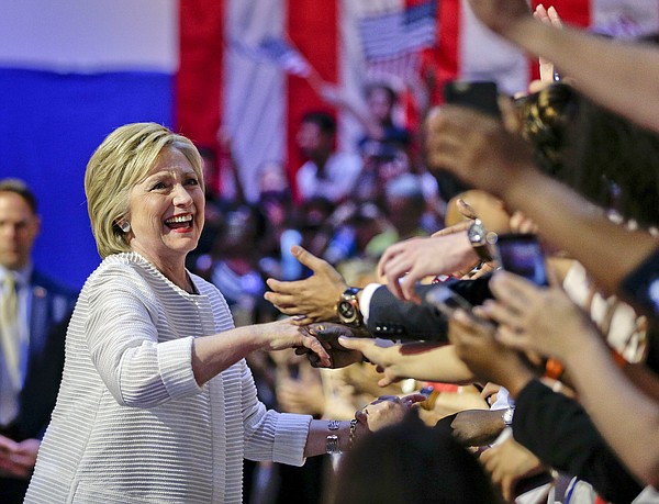 Democratic presidential candidate Hillary Clinton greets supporters as she arrives to speak during a presidential primary election night rally, Tuesday, June 7, 2016, in New York. (AP Photo/Julie Jacobson)