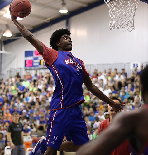 Blue Team guard Josh Jackson comes in for a dunk.