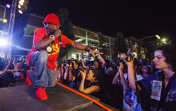 Public Enemy's Flavor Flav points out to the crowd during a free concert Saturday evening, June 25, 2016, as part of the Free State Festival. 