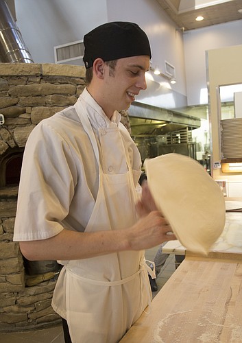 Zach Frieling, line manager at Limestone Pizza, prepares pizzas at the 814 Massachusetts St. eatery. Frieling won first place in the culinary arts competition last month at the SkillsUSA National Leadership and Skills Conference in Louisville, Ky. 
