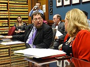 Bryan Caskey, director of elections for the Kansas Secretary of State's office, and Sen. Vicki Schmidt, R-Topeka, debate a new regulation that will require some voters in the upcoming elections who have not yet shown proof of U.S. citizenship to cast provisional ballots so they can only vote in federal races.