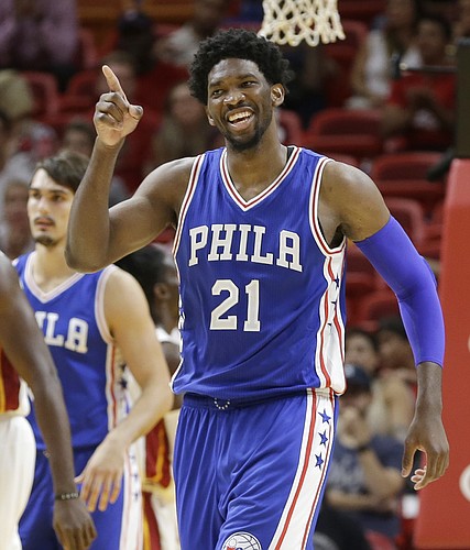 Philadelphia 76ers center Joel Embiid celebrates after scoring against the Miami Heat during the second half of an NBA preseason basketball game, Friday, Oct. 21, 2016, in Miami. (AP Photo/Alan Diaz)