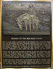 This bronze plaque by Lawrence artist Andy Foat was created to note the history of the Max Kade Annex at 1132 W. 11th St. The oldest building on the University of Kansas campus, the native stone structure was originally built in 1862 as a stable on property owned by James H. Lane, a prominent abolitionist and one of Kansas' first senators after statehood. It's now part of KU's Max Kade Center for German-American Studies, which is located in the former Sudler House adjacent to the annex.