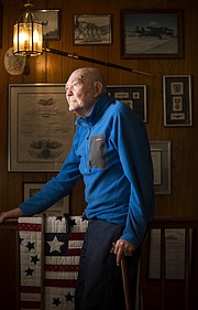 Lawrence veteran Vincent Muirhead, a retired naval commander, was 22 years old when he was stationed on the USS Maryland during the attack on Pearl Harbor on Dec. 7, 1941. Muirhead remembers planning a day of sightseeing before witnessing a Japanese plane flying overhead. He is pictured on Monday, Dec. 5, 2016, in his home.