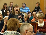 University of Kansas graduate student Megan Jones is shown in this file photo from Jan. 26, 2017, testifying at a Kansas Senate committee hearing in favor of a bill to allow colleges, universities and local governments to continue banning the carrying of concealed weapons in public buildings.