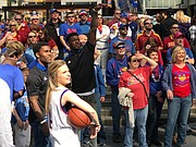 Kansas football players Mike Lee and Daylon Charlot compete in a game of P-I-G during a KU basketball pep rally at Power & Light, in Kansas City, Mo., on March 9, 2017.