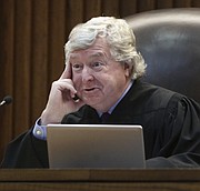 Kansas Supreme Court Justice Dan Biles listened and asked questions Thursday, March 16, 2017, during oral arguments in a legal fight over a state law banning a second-trimester abortion procedure and the larger question of whether the state constitution's Bill of Rights offered a fundamental right to an abortion. (Thad Allton/The Topeka Capital-Journal via AP, Pool)