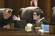 Kansas Supreme Court Justice Carol Beier asks questions Thursday, March 16, 2017, during oral arguments in a legal fight over a state law banning a second-trimester abortion procedure and the larger question of whether the state constitution's Bill of Rights offered a fundamental right to an abortion. (Thad Allton/The Topeka Capital-Journal via AP, Pool)