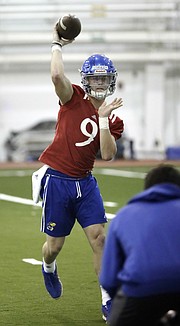 A redshirt sophomore quarterback who started the final three games of the 2016 season for Kansas, Carter Stanley throws at a spring football practice in March, of 2017.